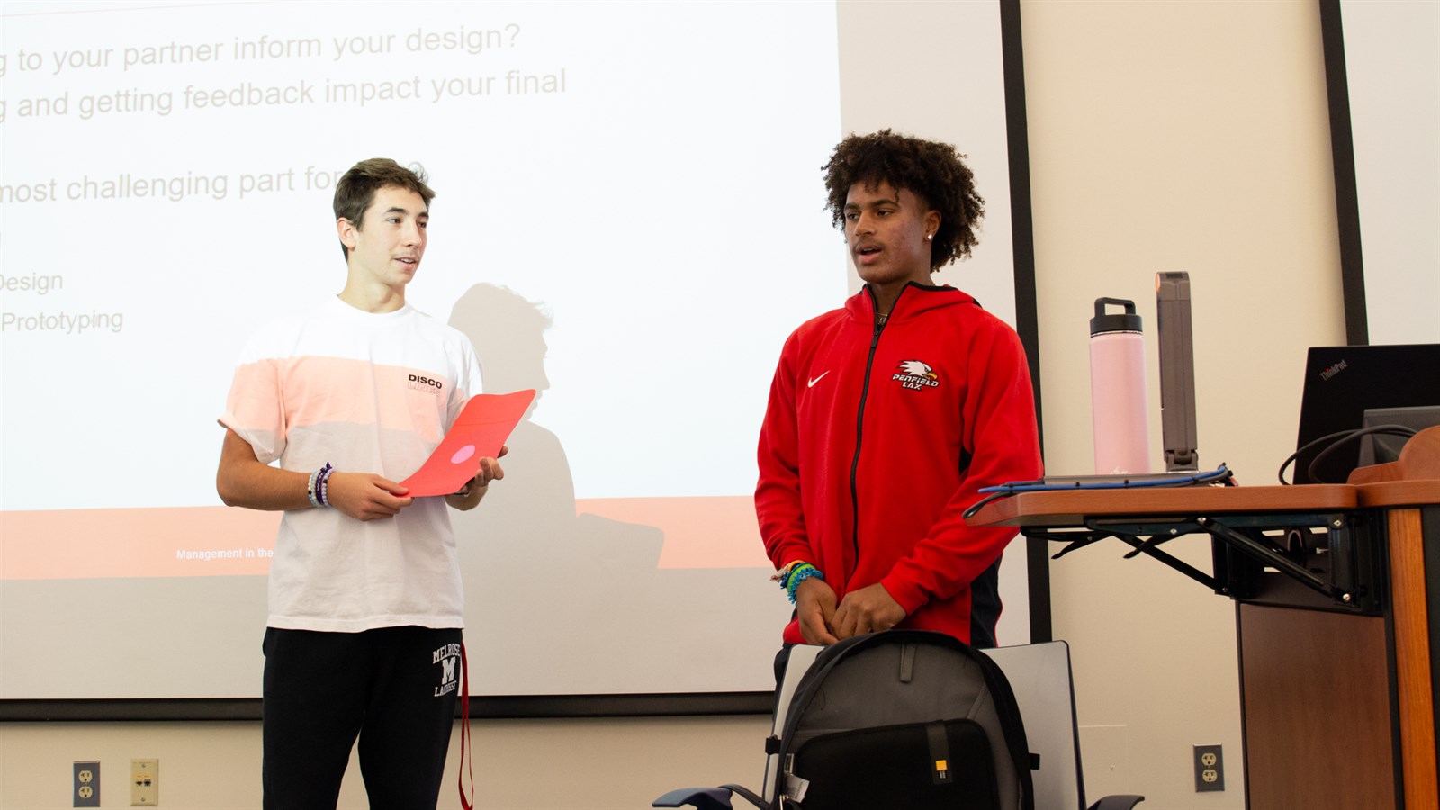 Two Lally business program students giving a presentation